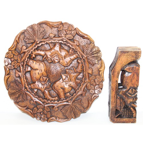 66 - Three African carved hardwood folding tables, the tops carved with elephants, rhinos, giraffes etc, ... 