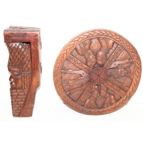 66 - Three African carved hardwood folding tables, the tops carved with elephants, rhinos, giraffes etc, ... 