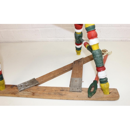 299 - Vintage spinning wheel painted in a barge ware style, and antique wool winder in pine, the wool wind... 