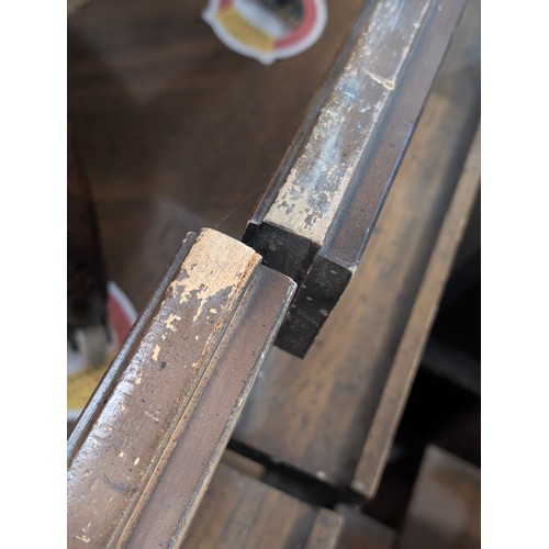 86 - An early 20th century walnut extending dining table with decorative Spanish Baroque style base, with... 