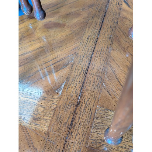 86 - An early 20th century walnut extending dining table with decorative Spanish Baroque style base, with... 