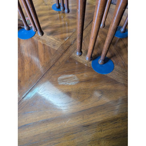 86 - An early 20th century walnut extending dining table with decorative Spanish Baroque style base, with... 