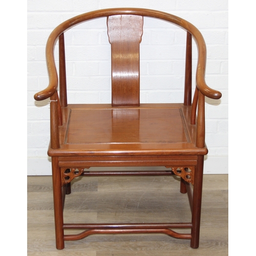 109 - A pair of Chinese hardwood chairs with horseshoe back and a similar matching hardwood table, 20th ce... 