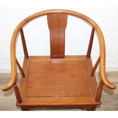 109 - A pair of Chinese hardwood chairs with horseshoe back and a similar matching hardwood table, 20th ce... 