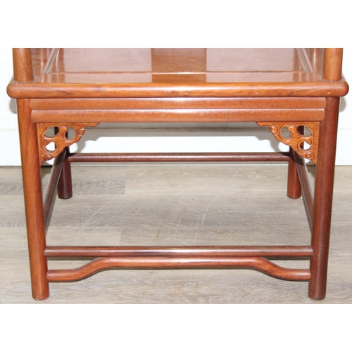 109 - A pair of Chinese hardwood chairs with horseshoe back and a similar matching hardwood table, 20th ce... 