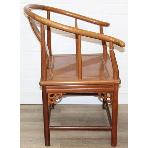 109 - A pair of Chinese hardwood chairs with horseshoe back and a similar matching hardwood table, 20th ce... 