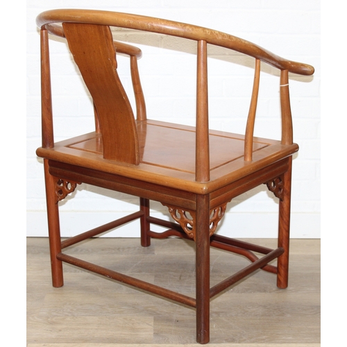 109 - A pair of Chinese hardwood chairs with horseshoe back and a similar matching hardwood table, 20th ce... 
