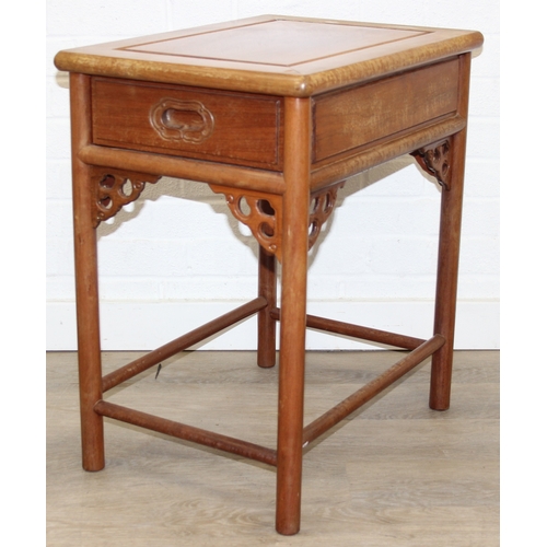 109 - A pair of Chinese hardwood chairs with horseshoe back and a similar matching hardwood table, 20th ce... 