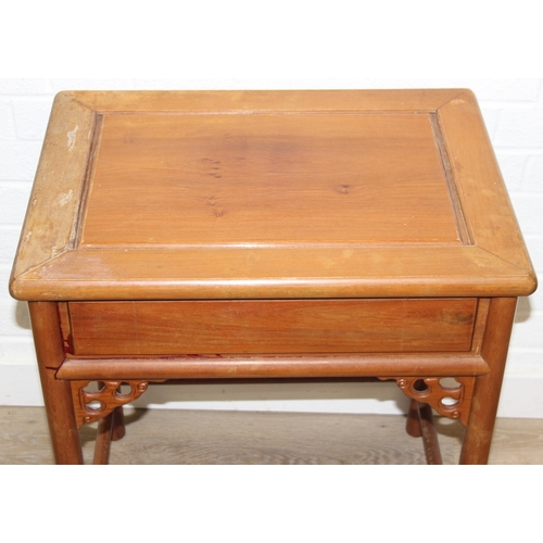 109 - A pair of Chinese hardwood chairs with horseshoe back and a similar matching hardwood table, 20th ce... 