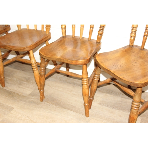 67 - A set of five antique farmhouse kitchen chairs with elm seats, turned spindle backs, each 89cm tall ... 