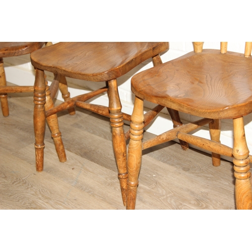 67 - A set of five antique farmhouse kitchen chairs with elm seats, turned spindle backs, each 89cm tall ... 