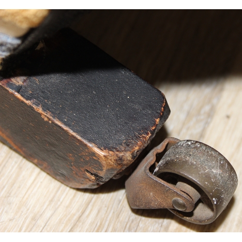 75 - In the manner of Howard & Sons, an antique deep seated armchair with multi-coloured stripey upholste... 