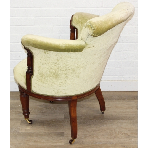 68 - A Victorian tub chair or armchair with green buttoned velvet upholstery and exposed carved wooden fr... 