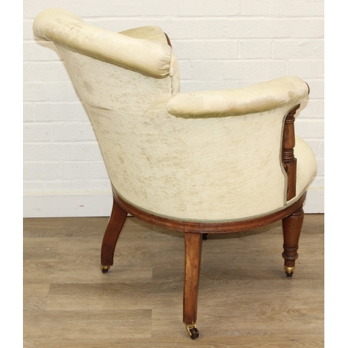 68 - A Victorian tub chair or armchair with green buttoned velvet upholstery and exposed carved wooden fr... 