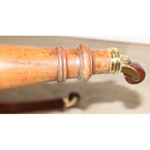 68 - A Victorian tub chair or armchair with green buttoned velvet upholstery and exposed carved wooden fr... 