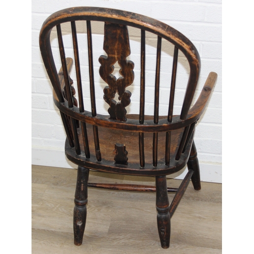 107 - An antique farmhouse stick-back Windsor armchair with elm seat, 19th century, with some very rustic ... 
