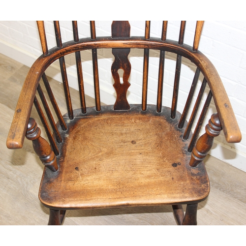 108 - An antique farmhouse stick-back Windsor armchair with elm seat, 19th century, 56cm wide x 113cm tall
