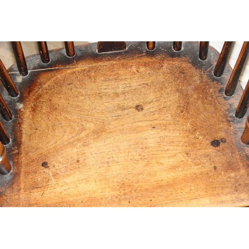 108 - An antique farmhouse stick-back Windsor armchair with elm seat, 19th century, 56cm wide x 113cm tall