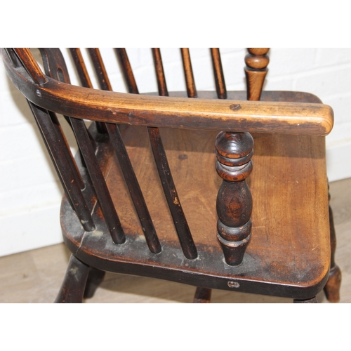 108 - An antique farmhouse stick-back Windsor armchair with elm seat, 19th century, 56cm wide x 113cm tall