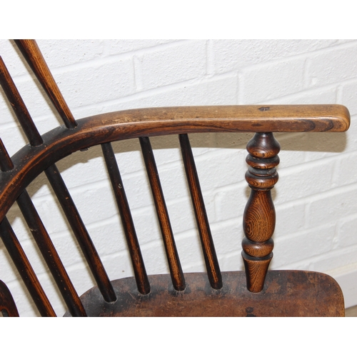 108 - An antique farmhouse stick-back Windsor armchair with elm seat, 19th century, 56cm wide x 113cm tall