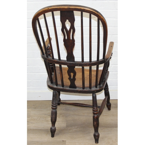 108 - An antique farmhouse stick-back Windsor armchair with elm seat, 19th century, 56cm wide x 113cm tall
