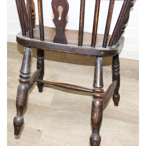 108 - An antique farmhouse stick-back Windsor armchair with elm seat, 19th century, 56cm wide x 113cm tall