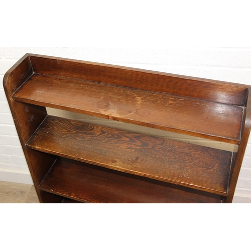94 - An early to mid 20th century oak bookcase with three shelves, 77cm x 17cm x 91cm
