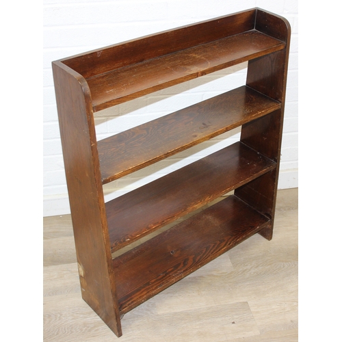 94 - An early to mid 20th century oak bookcase with three shelves, 77cm x 17cm x 91cm