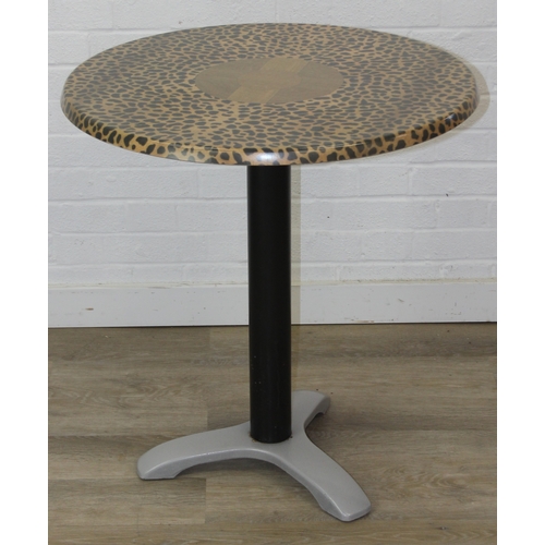 105 - An unusual bistro table with metal base, the table top with cheetah print design, the top by SM Fran... 