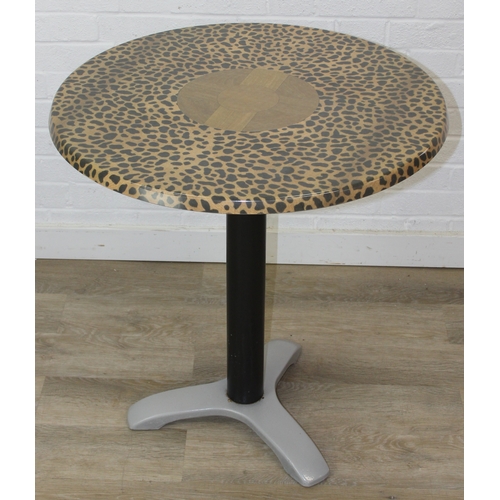 105 - An unusual bistro table with metal base, the table top with cheetah print design, the top by SM Fran... 