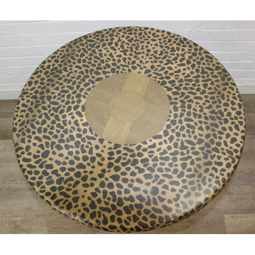 105 - An unusual bistro table with metal base, the table top with cheetah print design, the top by SM Fran... 