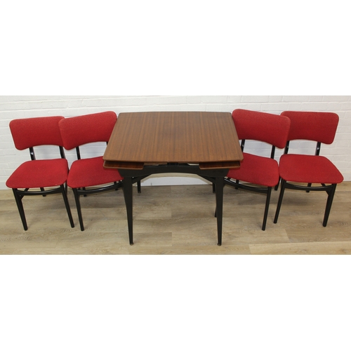 99 - A retro 1950's extending dining table and four chairs, the chairs with red fabric upholstery, seemin... 