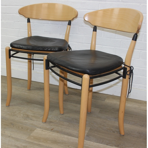72 - A pair of retro Dutch chairs by Hutten, with plain shaped back and leather cushions, each 79cm tall ... 