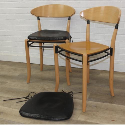 72 - A pair of retro Dutch chairs by Hutten, with plain shaped back and leather cushions, each 79cm tall ... 