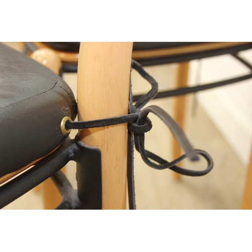 72 - A pair of retro Dutch chairs by Hutten, with plain shaped back and leather cushions, each 79cm tall ... 