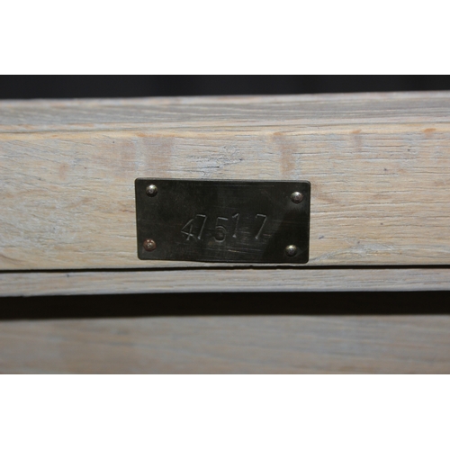 114 - A modern limed light oak side table with three tiers, a solid top tier and two slatted tiers under, ... 