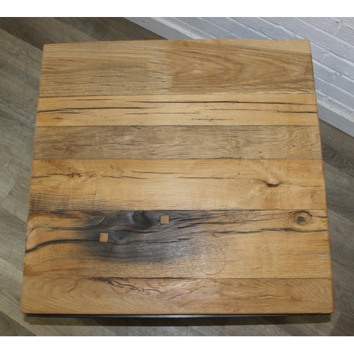 77 - A good quality reclaimed wooden topped side table with wrought metal industrial style bases, 75cm x ... 