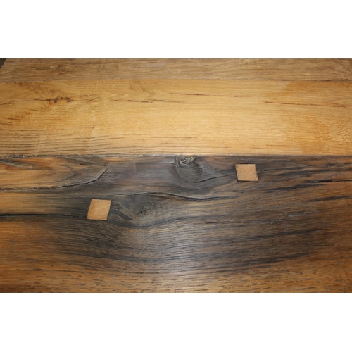 77 - A good quality reclaimed wooden topped side table with wrought metal industrial style bases, 75cm x ... 