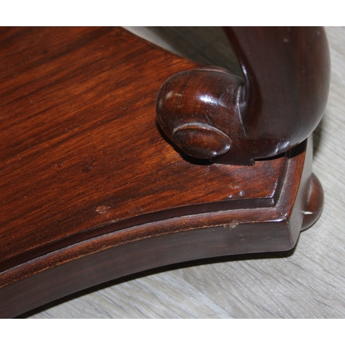 80 - A vintage brass inlaid hardwood table, possibly Indian, with swan shaped supports, 56cm in diameter ... 