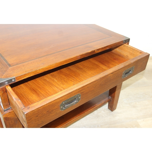 78 - An unusual oak or elm low side table in two parts, the top part a single campaign style drawer with ... 