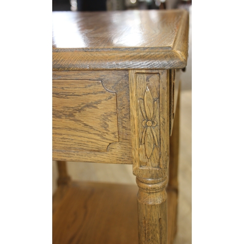 74A - A distressed oak bedside table with single drawer and brass handle, 65cm x 45cm x 75cm, one of two i... 