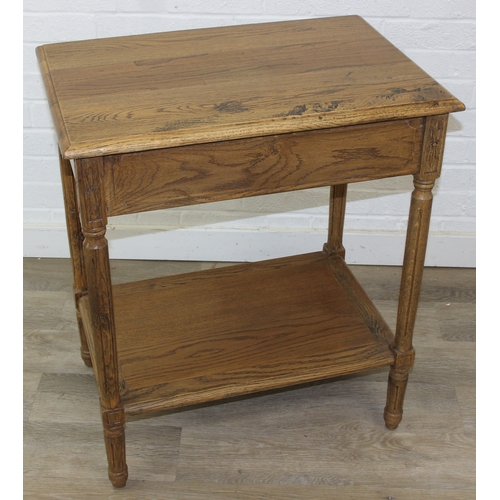 74A - A distressed oak bedside table with single drawer and brass handle, 65cm x 45cm x 75cm, one of two i... 