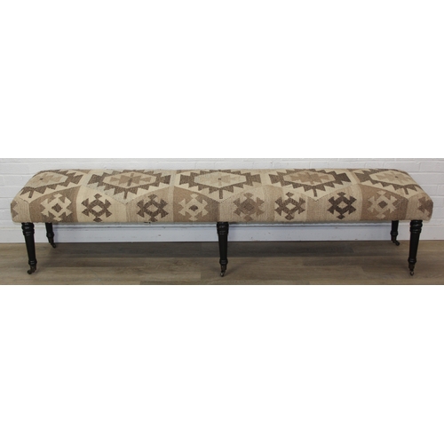 93 - A very large antique style footstool with kilim style top and turned ebonised legs, 220cm x 45cm x 5... 