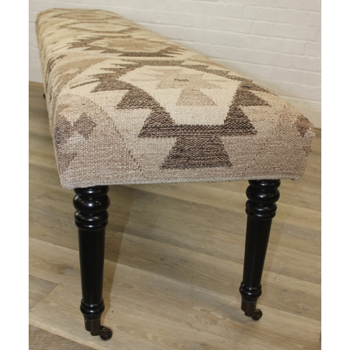 93 - A very large antique style footstool with kilim style top and turned ebonised legs, 220cm x 45cm x 5... 