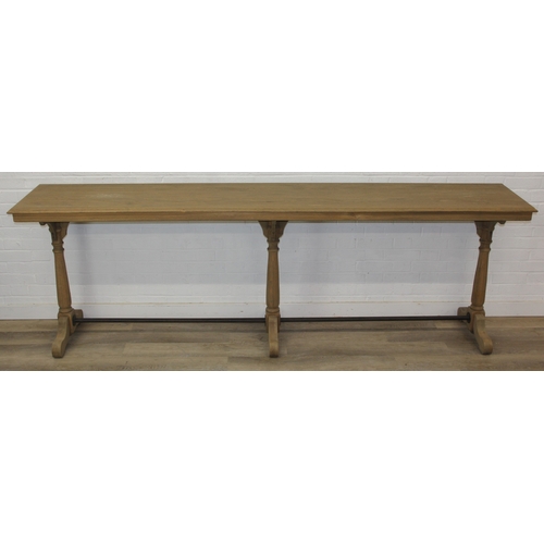 82 - A very large console table with pillar supports and iron stretchers, light or limed oak construction... 