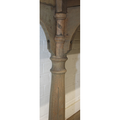 82 - A very large console table with pillar supports and iron stretchers, light or limed oak construction... 