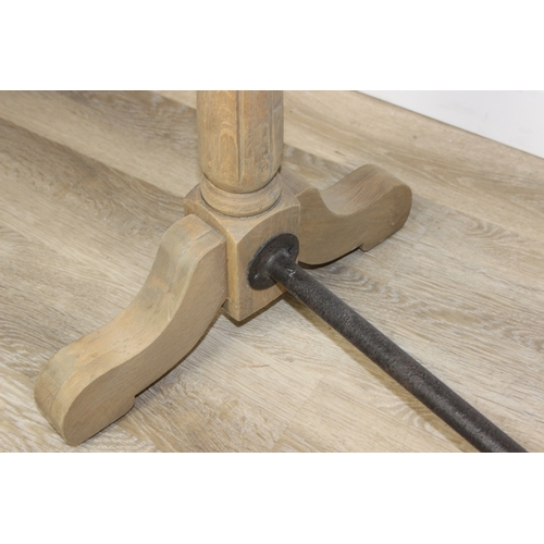 82 - A very large console table with pillar supports and iron stretchers, light or limed oak construction... 