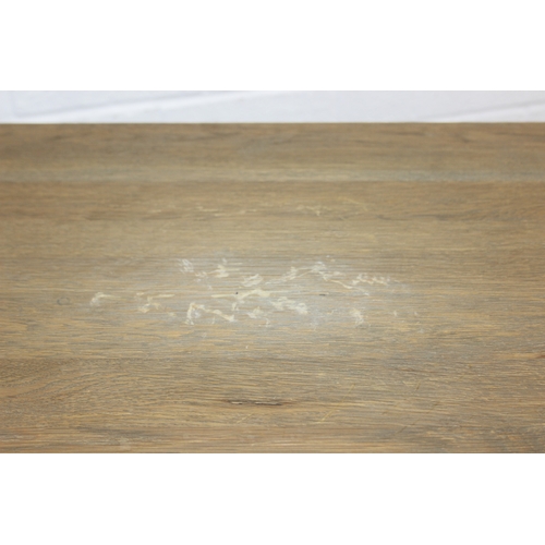 82 - A very large console table with pillar supports and iron stretchers, light or limed oak construction... 