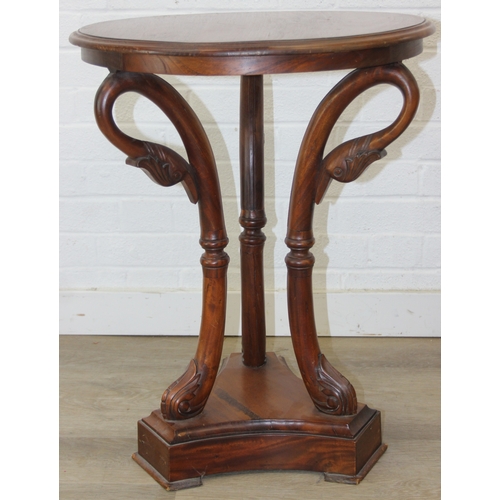 81 - An antique style round topped table with a trio of carved swans to base, 55cm in diameter x 66cm tal... 