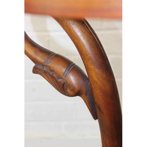 81 - An antique style round topped table with a trio of carved swans to base, 55cm in diameter x 66cm tal... 